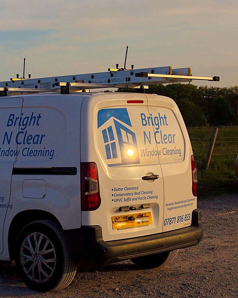 The Bright N Clear van with ladders on the roof