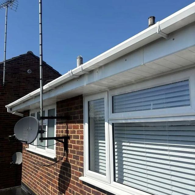 Clean white gutter, fascia and soffit after cleaning